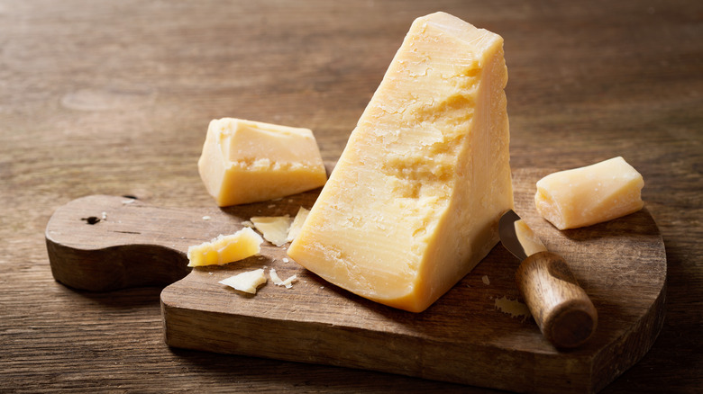 Parmesan cheese on cutting board