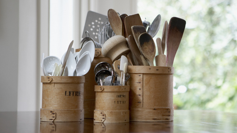 Cooking tools in wooden holders