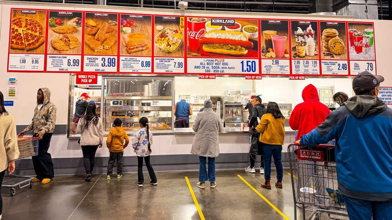 People wait in lines at a Costco food court