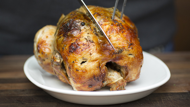 Rotisserie chicken being sliced