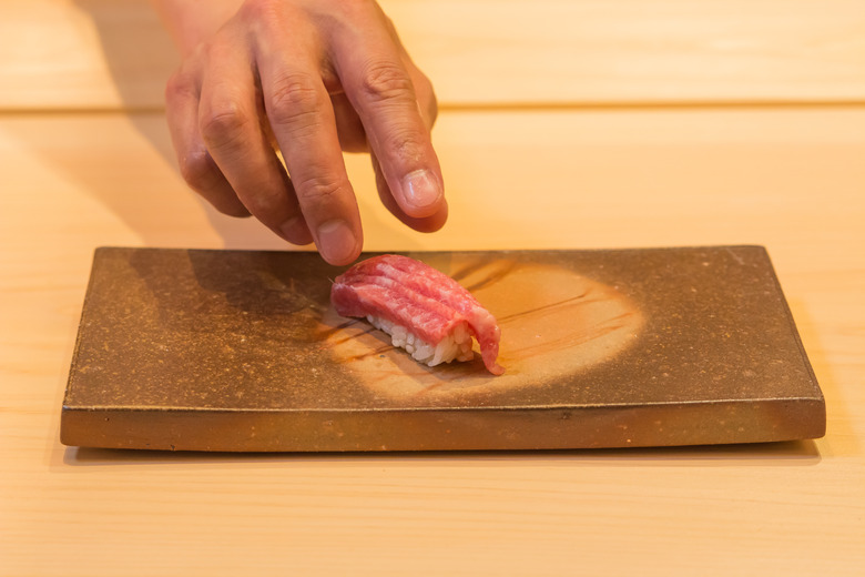 Sushi Ginza Onodera Chef Saito Serving Tuna Sushi 2