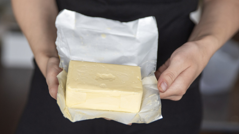 Block of European butter unwrapped from foil wrapper