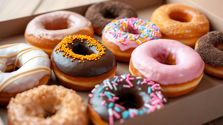A box of glazed and frosted donuts