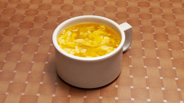egg drop soup in a white cup