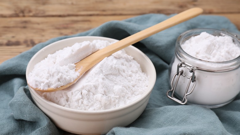 bowl and glass container of cornstarch on blue towel
