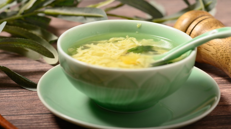 egg drop soup in a green bowl
