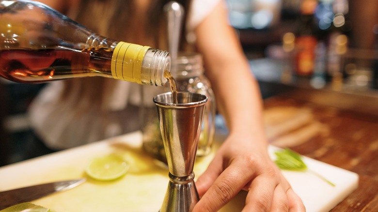 Rum being poured into jigger