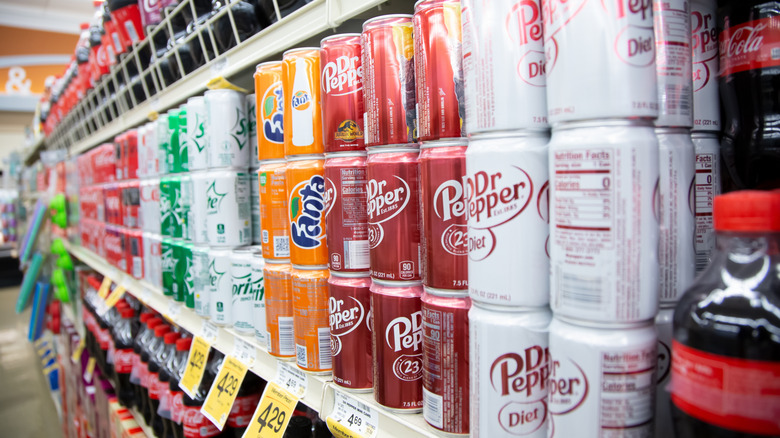 A view of several popular brands of mini can sodas
