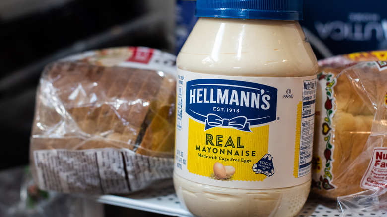 Jar of Hellmann's mayo next to loaf of bread