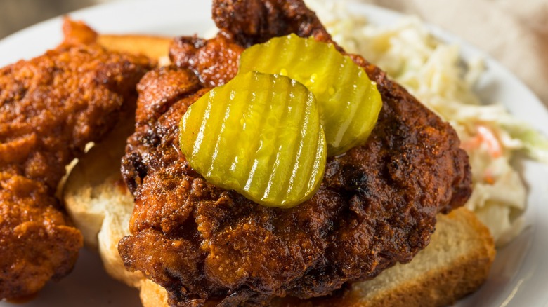 Nashville hot chicken sandwich topped with pickles 