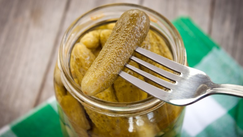 Pickle on a fork over a jar 