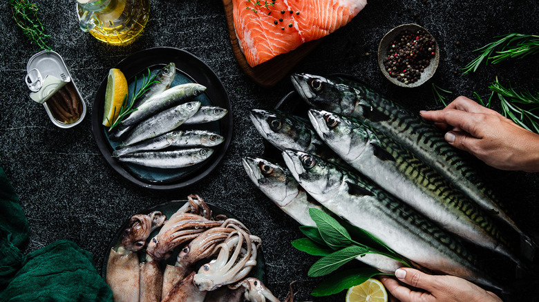 Assorted fresh fish with lemons and herbs