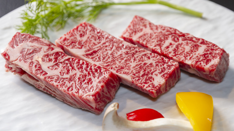 Three slices of marbled wagyu