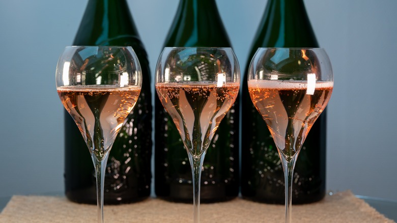 Champagne magnums with filled glasses