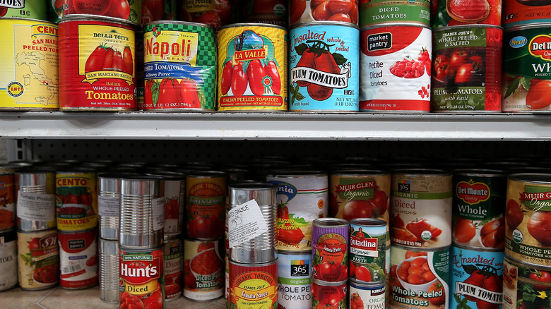 Grocery store display of canned tomatoes