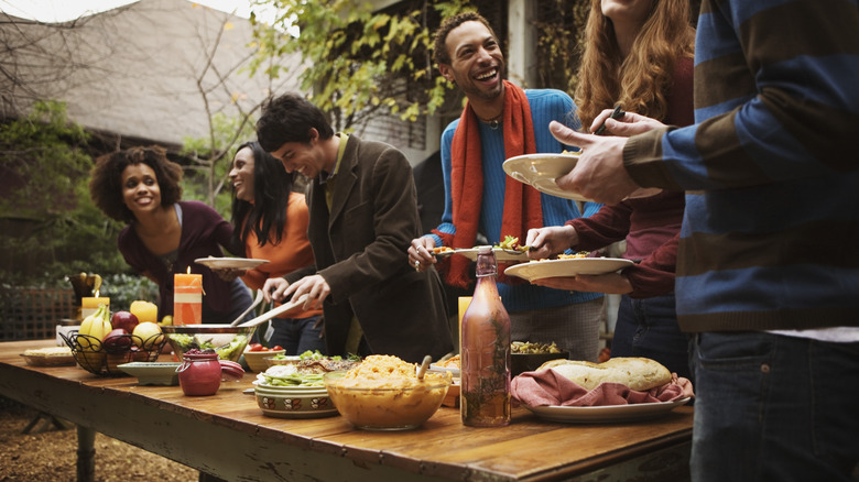 firends preparing to eat dinner