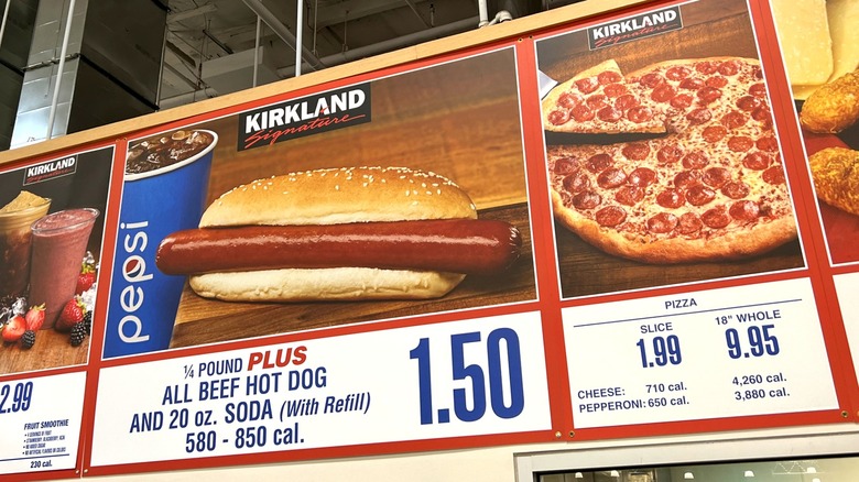 Costco food court with menu sign and one person in line