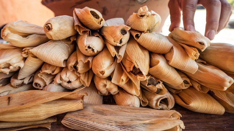 pile of tamales on wooden table
