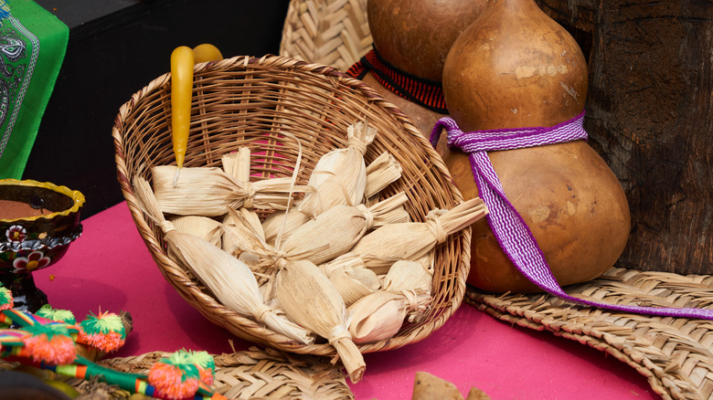 tamales in basket on ofrenda