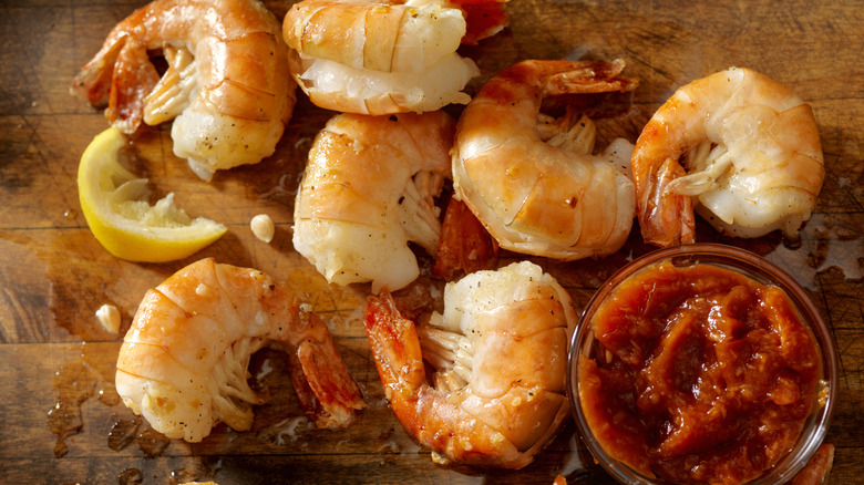 Cooked shell-on shrimp with dip