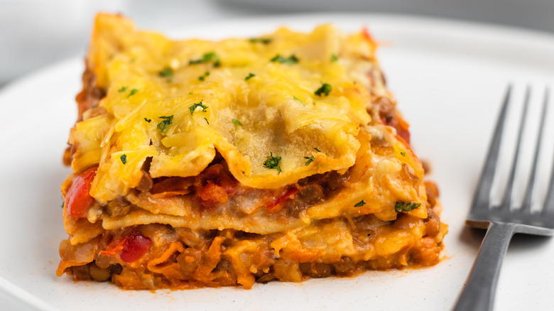 Lentil vegan lasagna on white plate