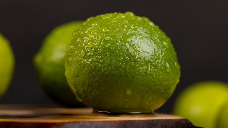 A wet lime on a wooden board