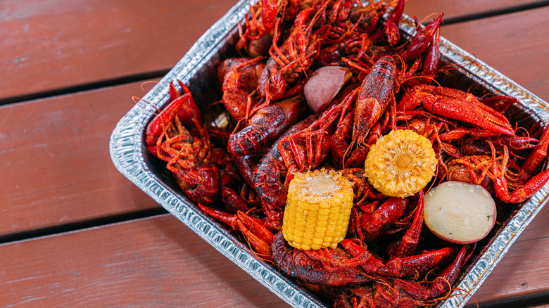 Boiled crawfish paired with potatoes and sweetcorn.