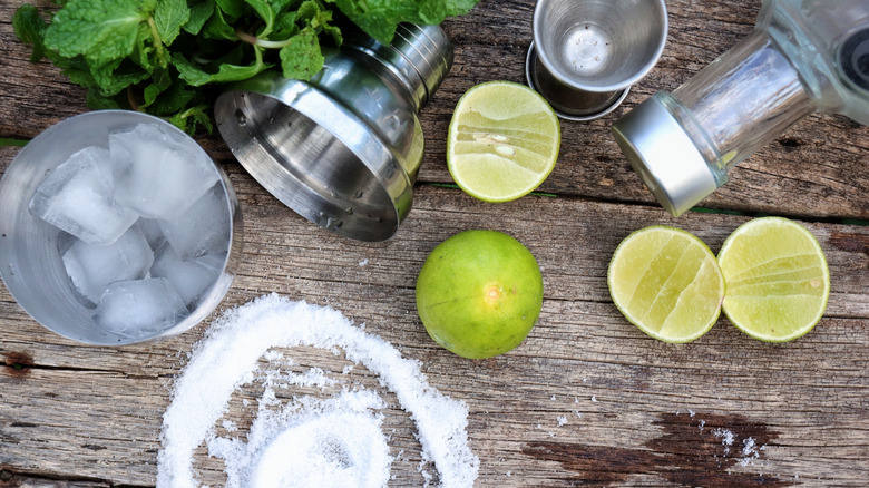 Various ingredients to make a lime margarita.