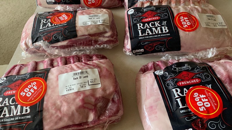 Multiple racks of lamb from Aldi are marked 50% off