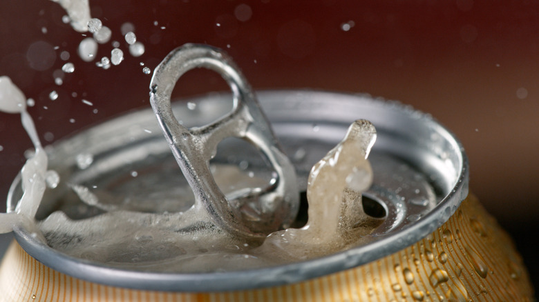 Carbonated drink exploding out of can