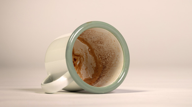 A stained cup of coffee.