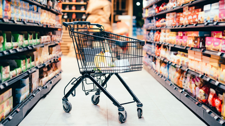 shopping cart in supermarket aisle