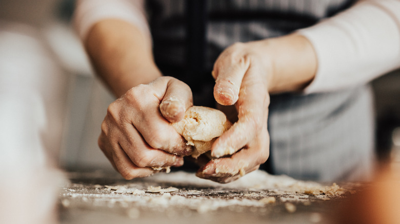 Woman kneading dough