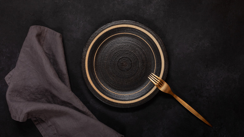 Napkin left beside plate