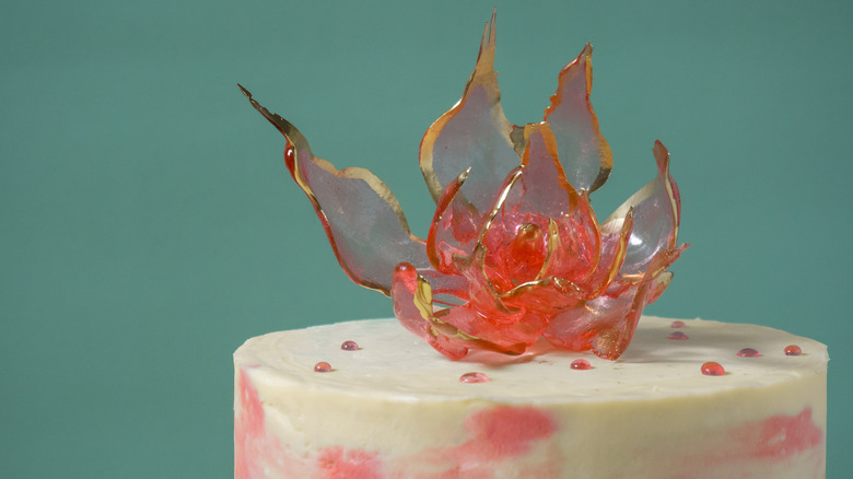 Flower made of isomalt sugar on cake