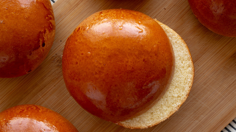 Brioche buns on a cutting board