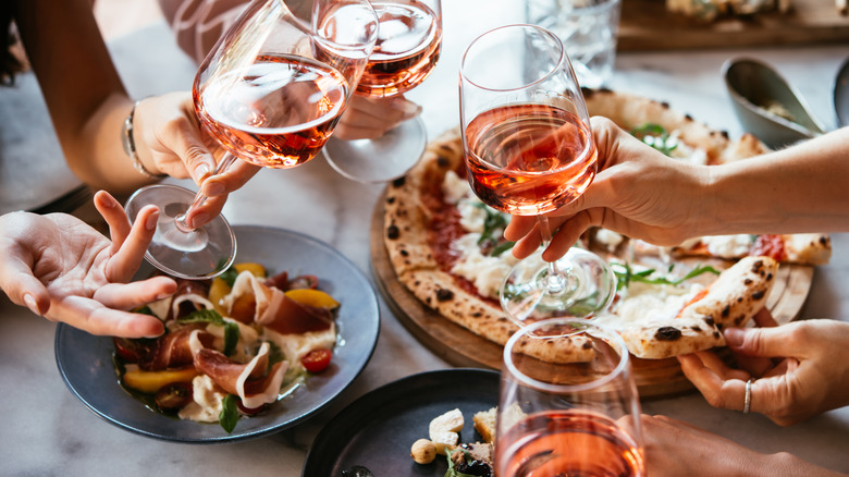 A group of people enjoying an Italian meal.