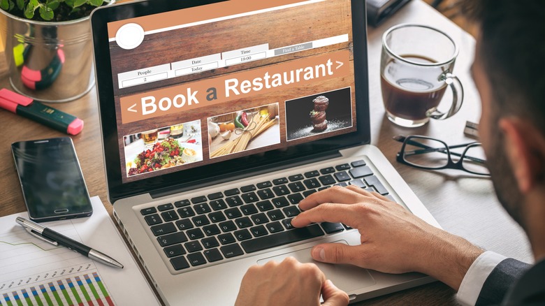 Man booking dinner reservation