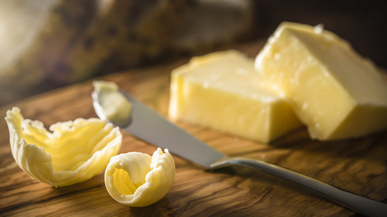 Curls of butter on cutting board