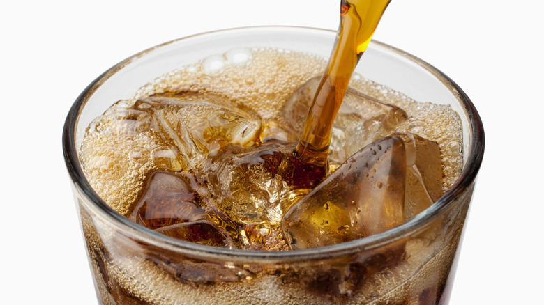 Pouring glass of Coke