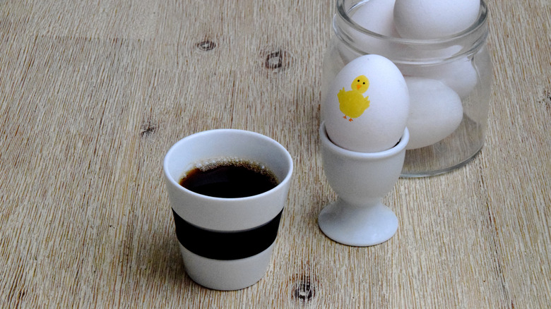 Cup of coffee and  whole eggs