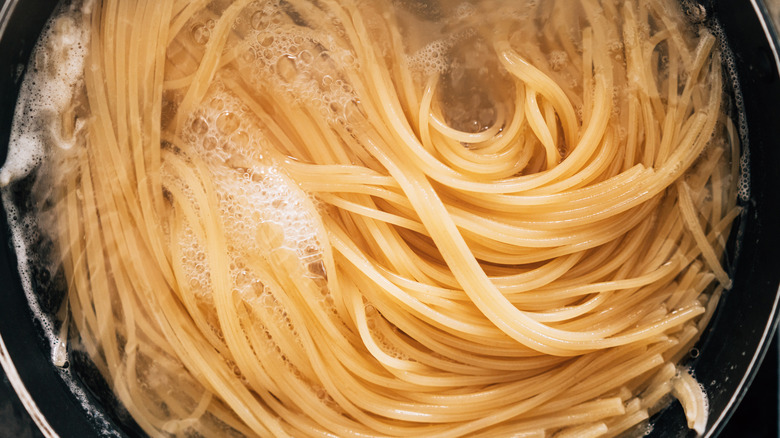 Water barely covering pasta in pot