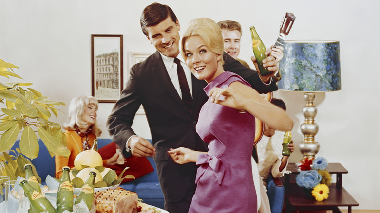 A dinner party during the 1960s.