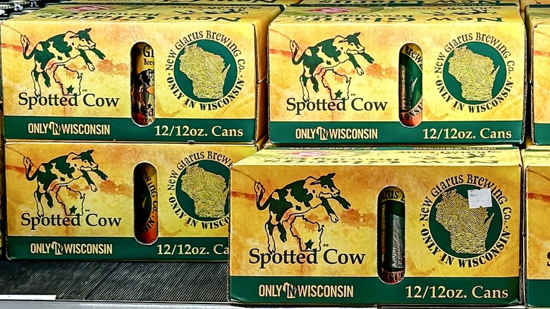 Cases of New Glarus Spotted Cow beer.