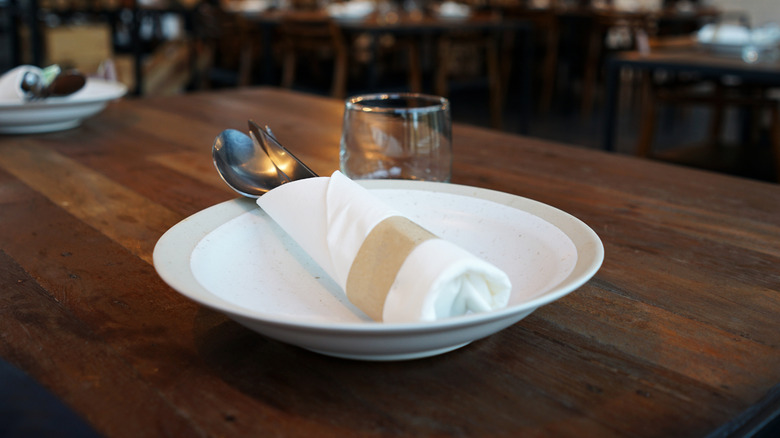 plate pictured on wooden table at restaurant