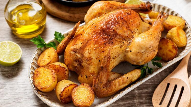 Whole roasted chicken with potatoes