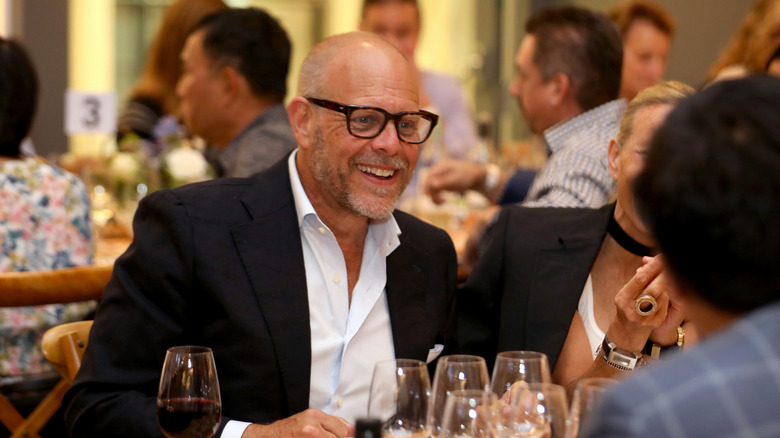 Alton Brown smiling at an event