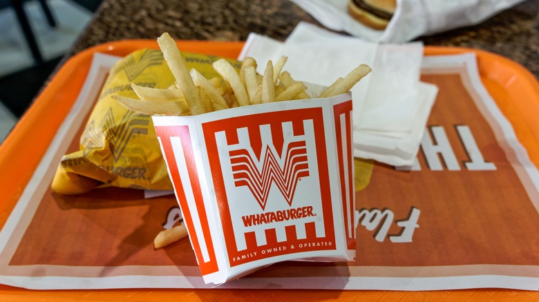 Whataburger fries on a tray inside of the restaurant