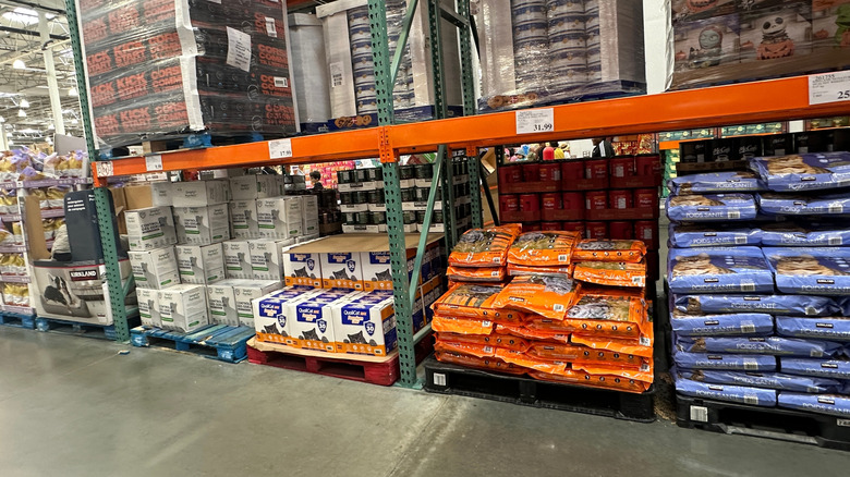 Cat food sits on a shelf in a Costco store