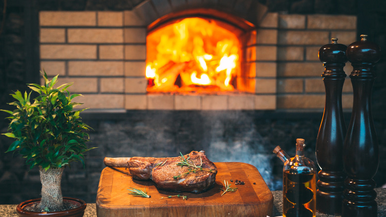 Tomahawk steak cooked in pizza oven